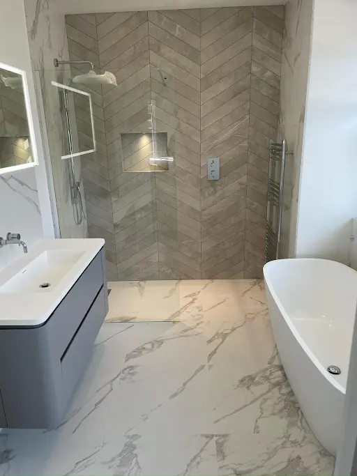 Walk-in shower and freestanding bath in a South London bathroom